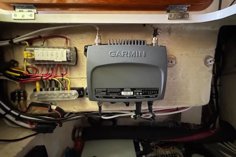 Slide: The Image of Garmin marine electronics in 2001 Hinckley Talaria 44 boat, showcasing wiring and connections. - 47