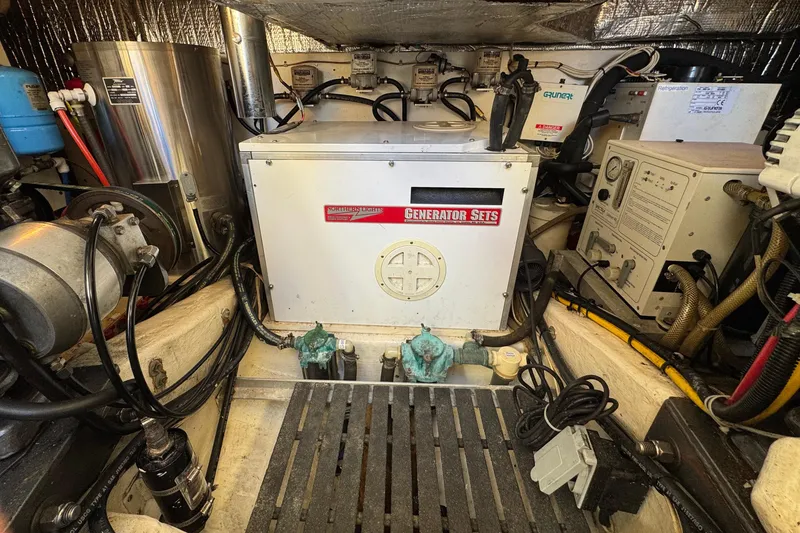 Slide: The Image of Engine room of 2001 Hinckley Talaria 44 with generator and equipment. - 50