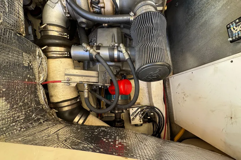 Slide: The Image of Engine compartment of a 2001 Hinckley Talaria 44 yacht, showcasing mechanical components. - 51