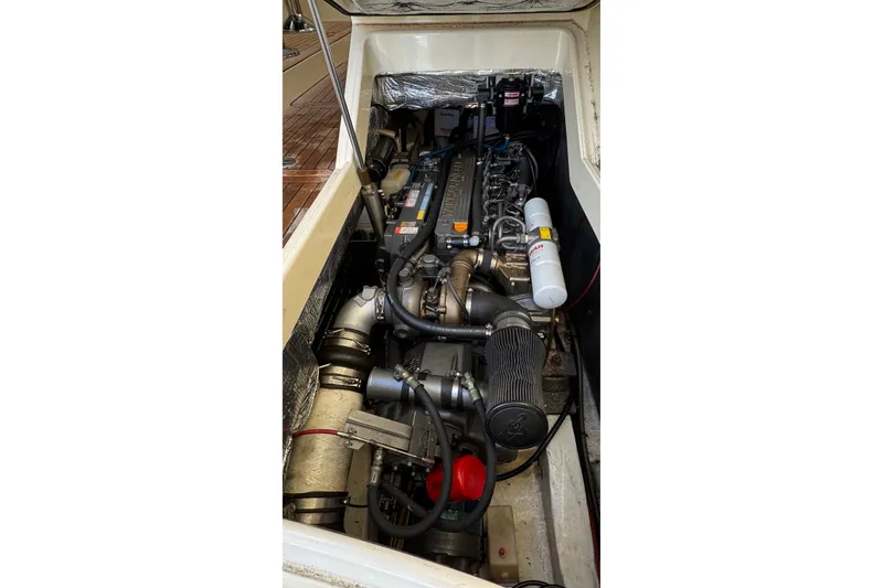 Slide: The Image of Engine compartment of a 2001 Hinckley Talaria 44 boat, showcasing detailed machinery. - 52