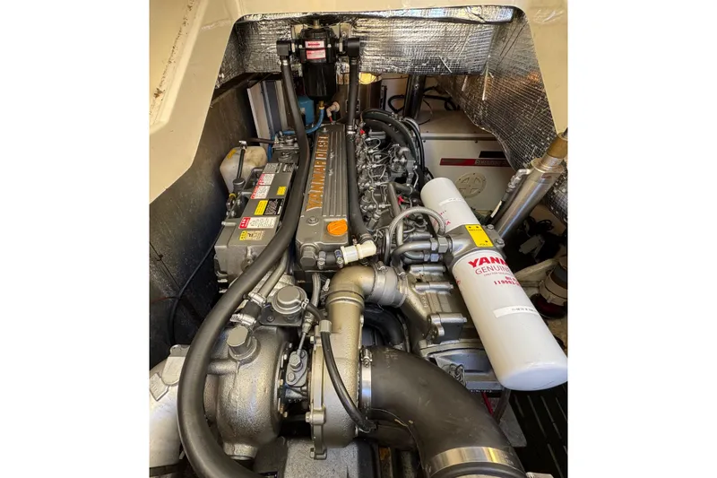 Slide: The Image of Engine compartment of 2001 Hinckley Talaria 44 with Yanmar diesel engine. - 54