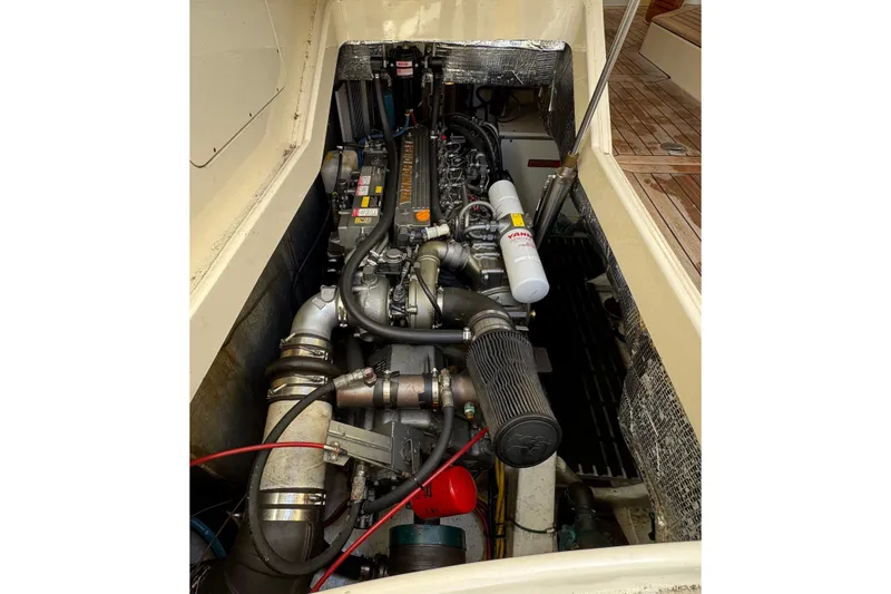 Slide: The Image of Engine compartment of a 2001 Hinckley Talaria 44 boat, showcasing detailed mechanical components. - 55