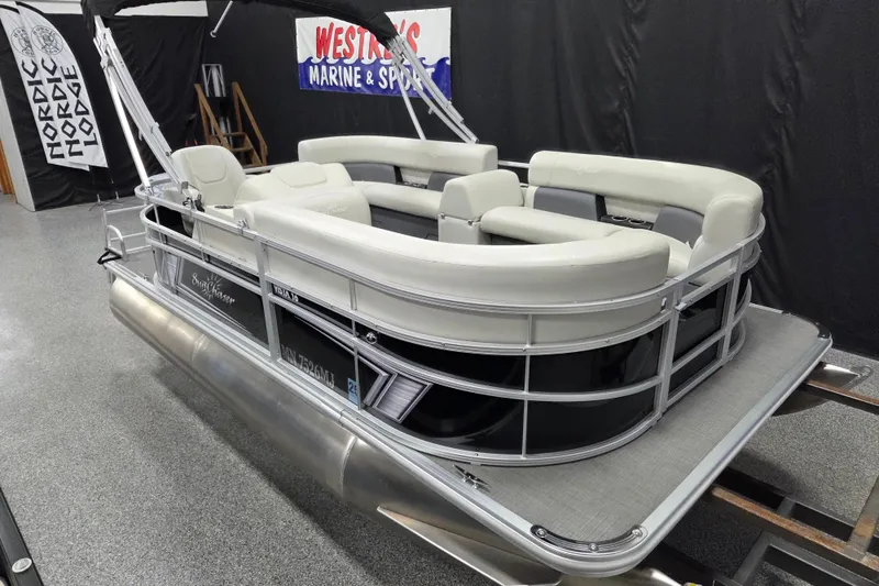 Slide: The Image of 2023 SunChaser Vista 16 LR pontoon boat with Yamaha 40 engine in showroom. - 2