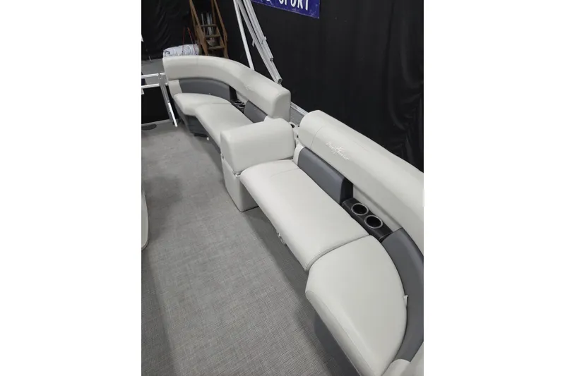 Slide: The Image of 2023 SunChaser Vista 16 LR boat interior with comfortable seating and cup holders. - 5