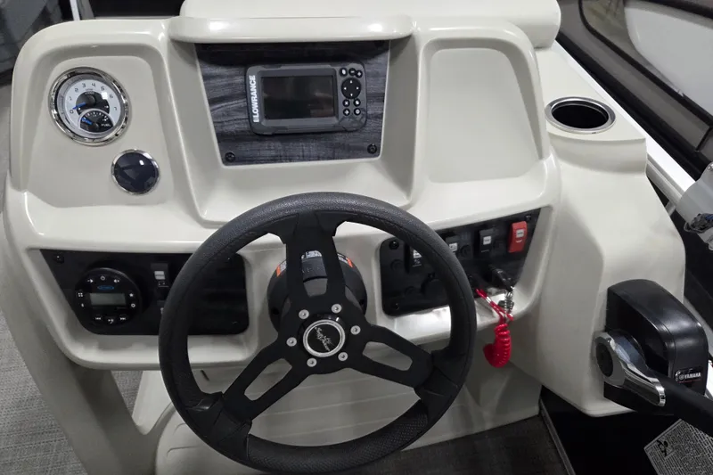 Slide: The Image of 2023 SunChaser Vista 16 LR boat interior with steering console and seating. - 7