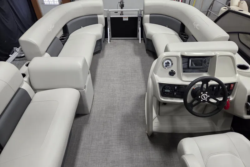 Slide: The Image of 2023 SunChaser Vista 16 LR boat dashboard with steering wheel and control panel. - 8