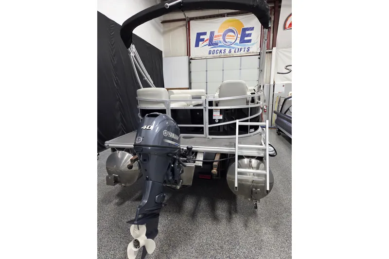 Slide: The Image of Interior of 2023 SunChaser Vista 16 LR pontoon boat with plush seating and modern helm. - 9