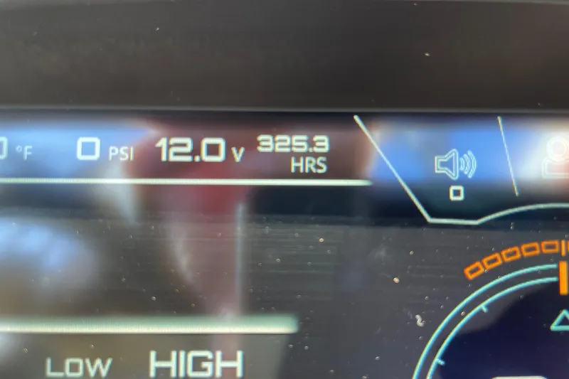 Slide: The Image of Dashboard display of 2020 Nautique Super Air Nautique G25 showing 12.0V and 325.3 hours. - 13