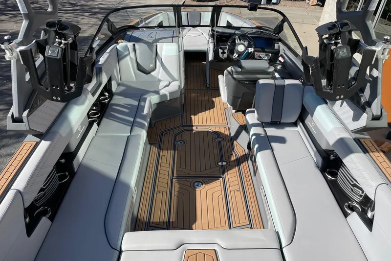 Slide: The Image of 2020 Nautique Super Air Nautique G25 interior with sleek seating and modern design. - 5