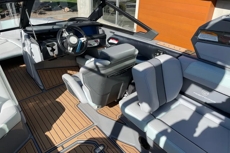 Slide: The Image of 2020 Nautique Super Air Nautique G25 interior with sleek design and modern dashboard. - 6