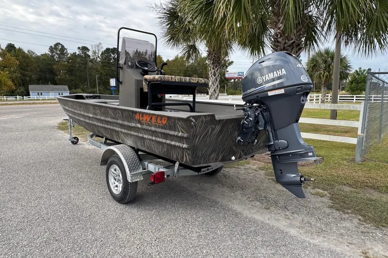 Slide: The Image of 2026 Alweld 1656VV Marsh Console CC boat with Yamaha outboard motor on trailer. - 3