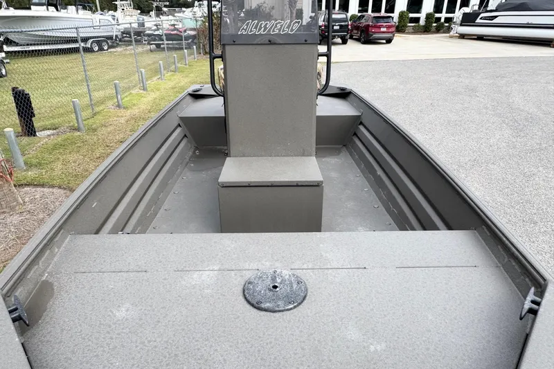 Slide: The Image of 2026 Alweld 1656VV Marsh Console CC boat interior, showcasing console and seating. - 11