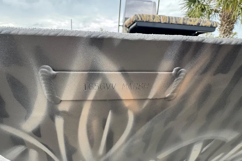 Slide: The Image of 2026 Alweld 1656VV Marsh Console CC boat with camouflage pattern and embossed model name. - 5