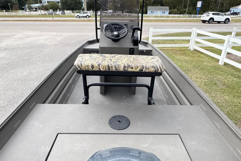 Slide: The Image of 2026 Alweld 1656VV Marsh Console CC boat interior with camo seat and steering console. - 10