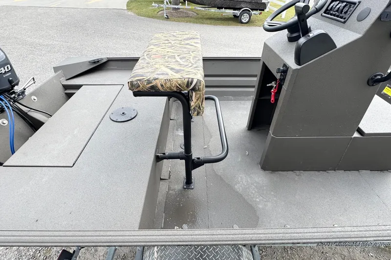 Slide: The Image of 2026 Alweld 1656VV Marsh Console CC boat interior with camo seat and control console. - 8