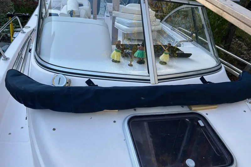 Slide: The Image of 1998 Grady-White Seafarer 226 boat with hula dancer figurines on the dashboard. - 6