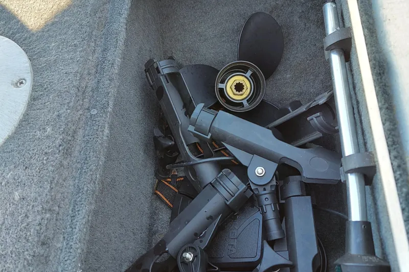 Slide: The Image of Boat storage compartment with various black plastic components, Alumacraft Backtroller 14, 1997 model. - 3