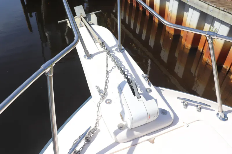 Slide: The Image of Bow of 1999 Grady-White Islander 268 with anchor chain and railing. - 17