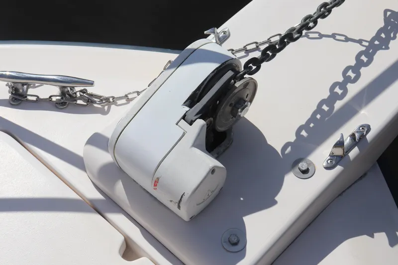 Slide: The Image of Anchor windlass on 1999 Grady-White Islander 268 boat deck. - 18