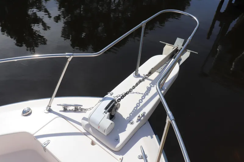 Slide: The Image of 1999 Grady-White Islander 268 boat anchor and railing detail on calm water. - 19