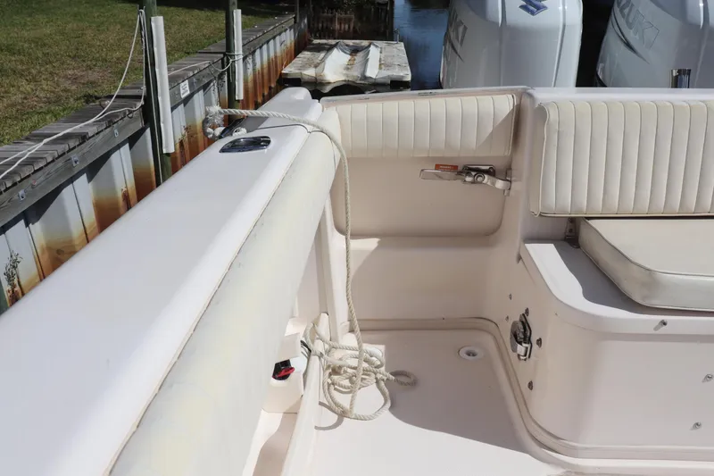Slide: The Image of 1999 Grady-White Islander 268 boat interior with seating and rope detail. - 5
