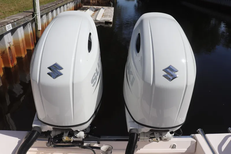 Slide: The Image of Twin Suzuki outboard motors on a 1999 Grady-White Islander 268 boat. - 8