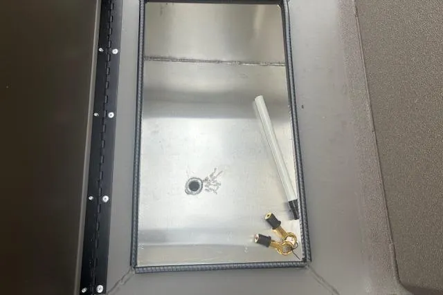 Slide: The Image of Interior view of 2026 Alweld 1760VV Marsh Console CC boat compartment. - 12