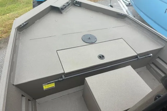 Slide: The Image of 2026 Alweld 1760VV Marsh Console CC boat interior with storage compartment. - 8