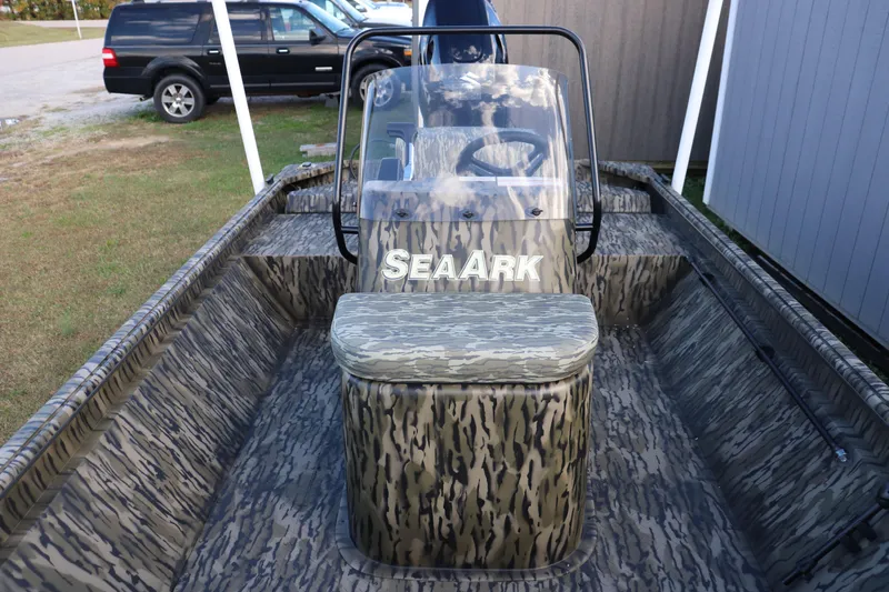 Slide: The Image of 2026 SeaArk Shadow 18T CC boat with camouflage design and central console. - 3