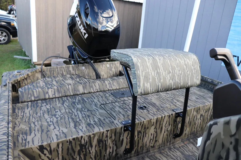 Slide: The Image of 2026 SeaArk Shadow 18T CC boat with camo design and Suzuki outboard motor. - 5