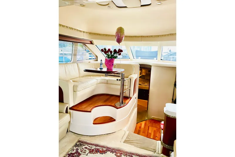 Slide: The Image of Luxurious interior of 2005 Sea Ray 420 Sedan Bridge with elegant seating and decor. - 24