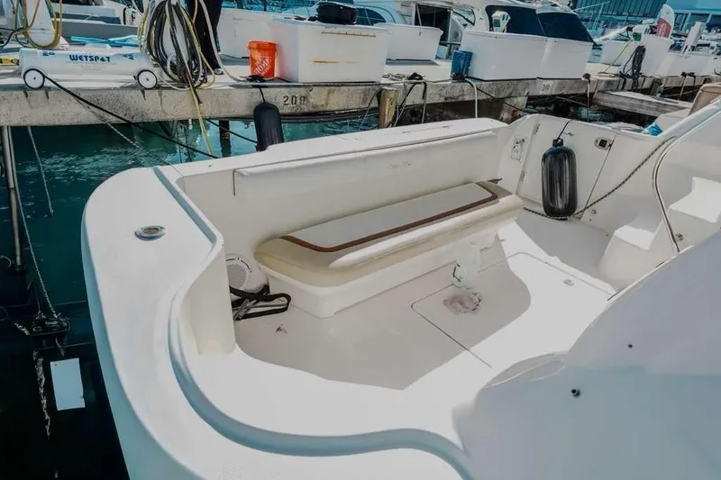 Slide: The Image of 2005 Sea Ray 420 Sedan Bridge boat deck with seating, docked at marina. - 26
