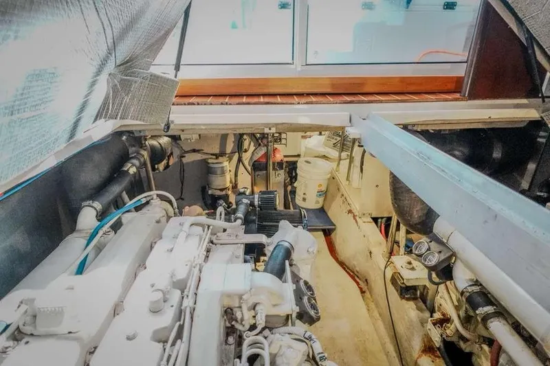 Slide: The Image of Engine room of 2005 Sea Ray 420 Sedan Bridge yacht, showcasing mechanical components. - 34