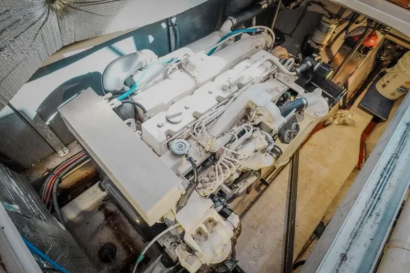 Slide: The Image of Engine room of 2005 Sea Ray 420 Sedan Bridge, showcasing detailed mechanical components. - 38