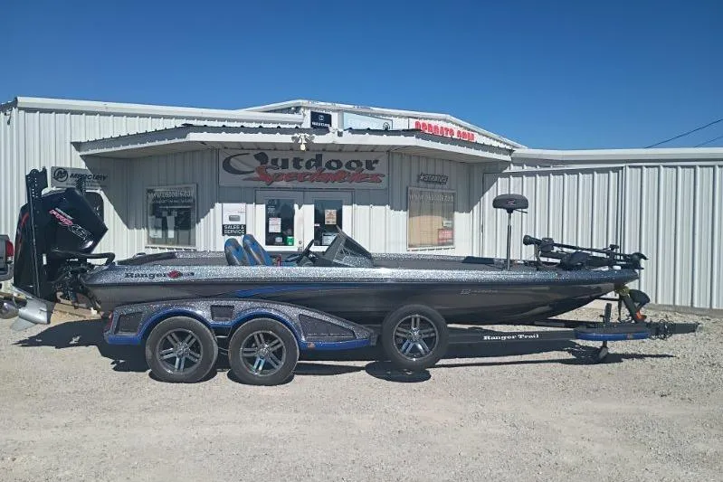 The Image of 2021 Ranger Z521L boat on trailer outside Outdoor Superstore building. - 1