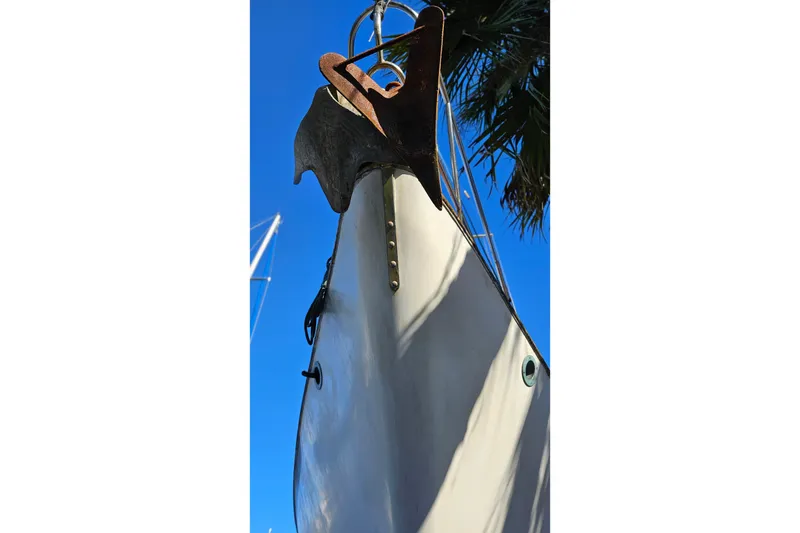 Slide: The Image of Bow of 1993 Pacific Seacraft 37 sailboat with anchor against blue sky. - 5