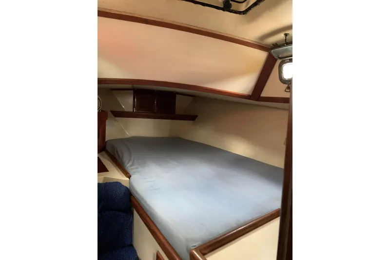 Slide: The Image of Cozy cabin interior of 1993 Pacific Seacraft 37 sailboat with a comfortable bed. - 6