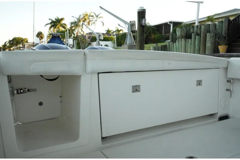 Slide: The Image of 2018 Regulator 28 boat storage compartments with sleek white design. - 10