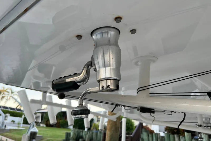 Slide: The Image of Close-up of a 2018 Regulator 28 boat's fishing rod holder and reel handle. - 14