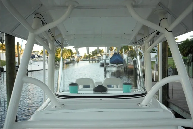 Slide: The Image of 2018 Regulator 28 boat docked in a marina, view from the helm. - 22