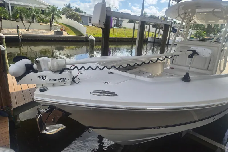 Slide: The Image of 2018 Regulator 28 boat interior with seating and storage compartments. - 5