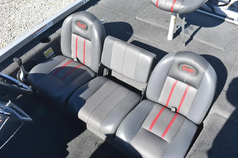 Slide: The Image of 2015 Ranger RT178C boat seats with gray and red accents, featuring a carpeted interior. - 10