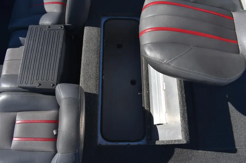 Slide: The Image of 2015 Ranger RT178C boat interior with storage compartment and cushioned seats. - 11