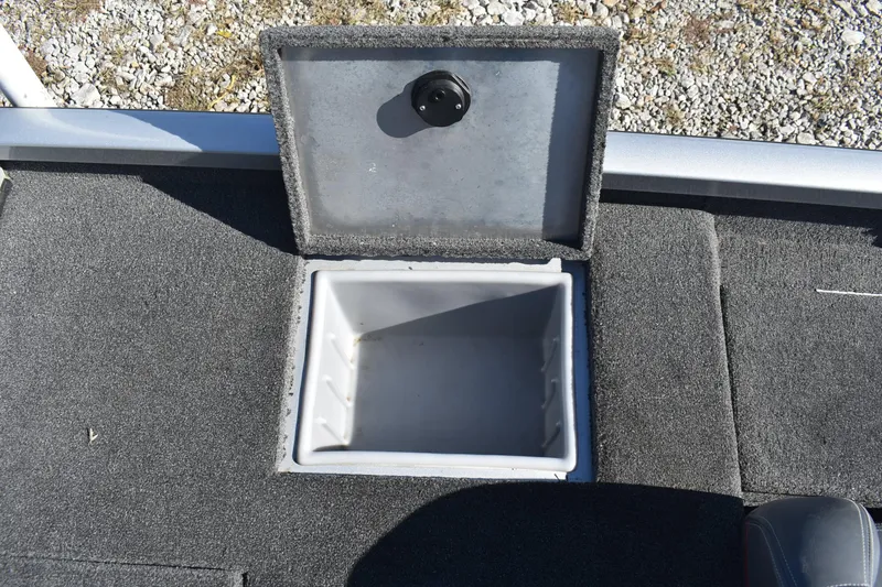 Slide: The Image of Open storage compartment on 2015 Ranger RT178C boat, featuring carpeted interior. - 12