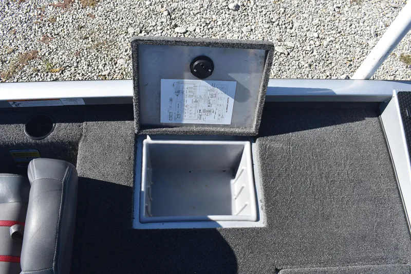Slide: The Image of 2015 Ranger RT178C boat storage compartment with open lid, showing interior and diagram. - 13