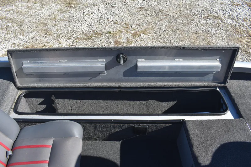 Slide: The Image of 2015 Ranger RT178C boat storage compartment with open lid, revealing interior space. - 14