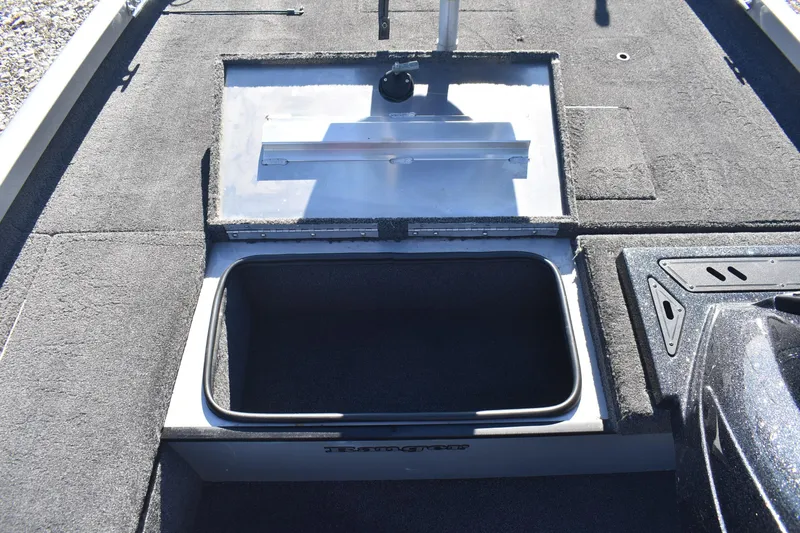 Slide: The Image of 2015 Ranger RT178C boat storage compartment with open lid, showcasing spacious interior. - 15