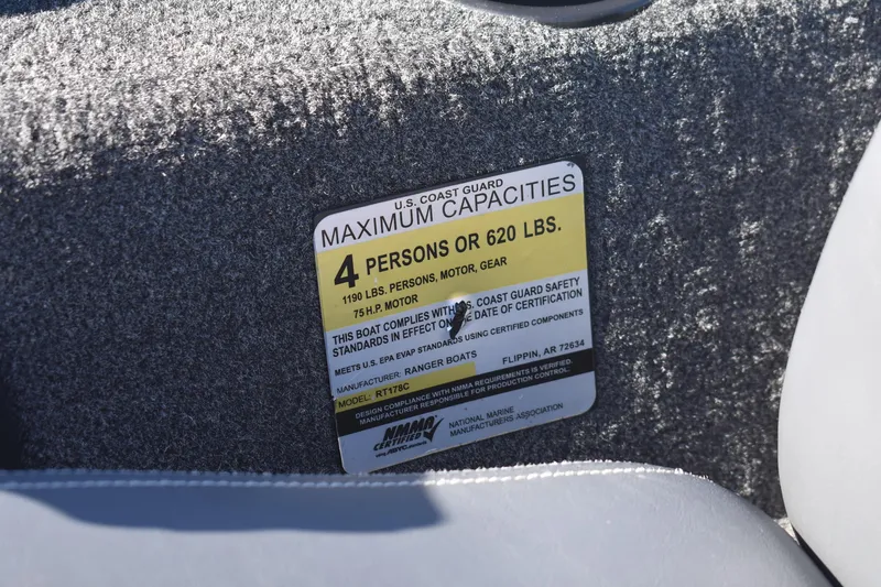 Slide: The Image of 2015 Ranger RT178C boat capacity label, maximum 4 persons or 620 lbs, U.S. Coast Guard compliant. - 20