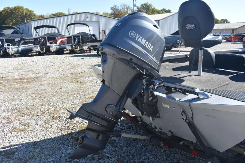 Slide: The Image of 2015 Ranger RT178C boat with Yamaha outboard motor in a gravel lot. - 5