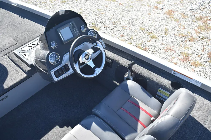 Slide: The Image of 2015 Ranger RT178C boat cockpit with steering wheel and control panel. - 9